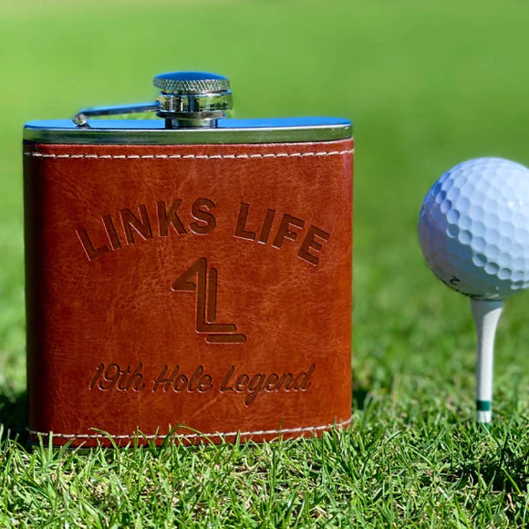 Links Life Flask and golf ball on grass